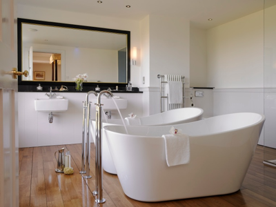 Twin Baths With Orchids