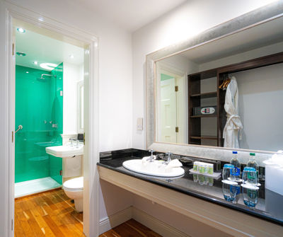 Elegant en-suite bathroom at Dunraven Hotel accommodation in Adare