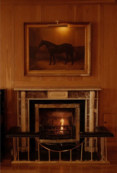 Fireplace in the sitting room of the luxury Dunraven Arms Hotel in County Limerick